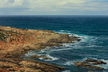 Stunning coastal view of rocky shoreline along the South African coast during daylight hours