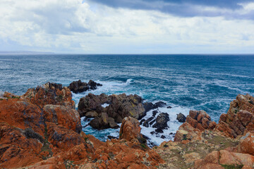 Rugged coastline view along the South African shore on a cloudy afternoon