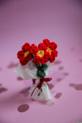 A bouquet of red knitted flowers on a beautiful background, a bouquet of red flowers, knitted flowers, knitted bouquets, handmade, knitted flowers, knitted gifts and toys