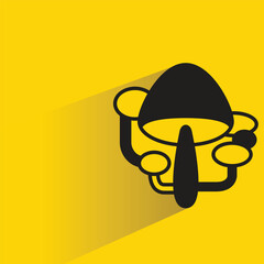 mushroom icon with drop shadow on yellow background