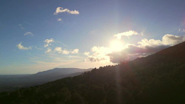 A view of the mountains during sunset hours from above
