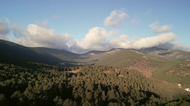 Aerial view of mountains during a cold sunny day