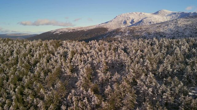Flying over a snow mountain during winter season