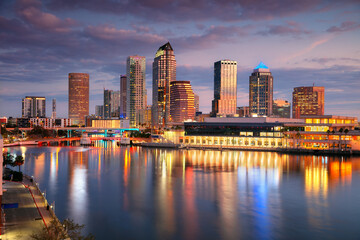 Tampa, Florida, USA. Aerial cityscape image of Tampa, Florida with reflection of the city skyline in the water at beautiful sunrise.