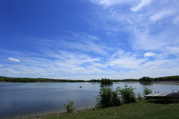 Tranquil Lakeside Dock Under Clear Blue Sky