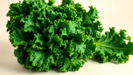 Fototapeta premium Fresh green kale leaves with curly edges on light background