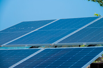 Solar powered panels are installed in farmlands or fields or farms. Rows of sustainable energy...