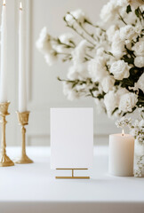 Blank card mock up on the table decorated with white roses and candles