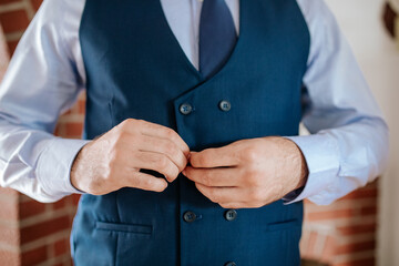 Groom Adjusting Vest – Wedding Morning Preparation