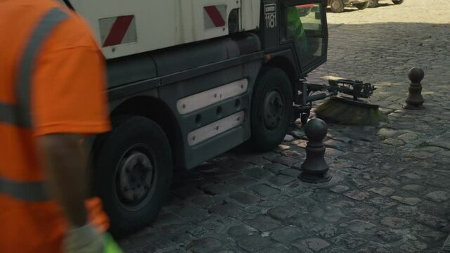 Close Up Street Sweeper Cleaning Cobblestone Roads in Le Mans, France