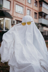 Halloween, a ghost in glasses, a ghost on a walk, a photo session on Halloween