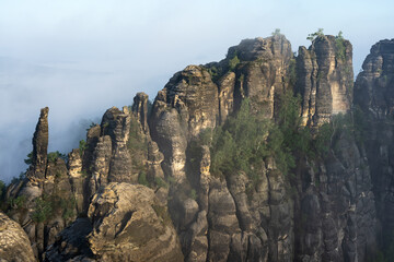 An early morning in mountain. Schrammsteine - group of rocks are a long, strung-out, very jagged in the Elbe Sandstone Mountains located in Saxon Switzerland in East Germany.