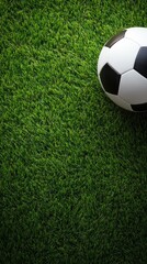 Soccer ball resting on vibrant green grass during a sunny afternoon in a park setting perfect for outdoor games