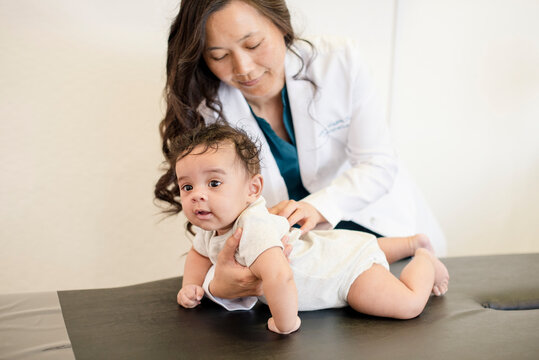 Doctor doing a close up evaluation of baby