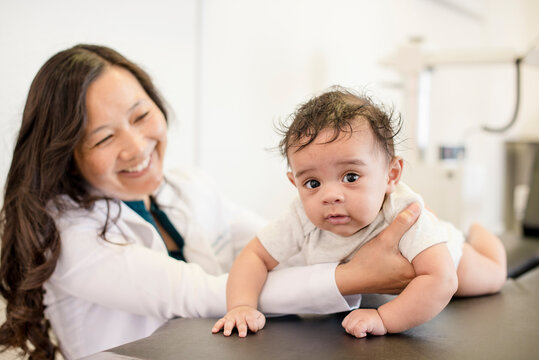 Close up of baby getting evaluated by doctor