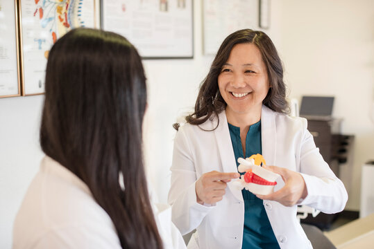 Doctor showing a bulging disc to patient