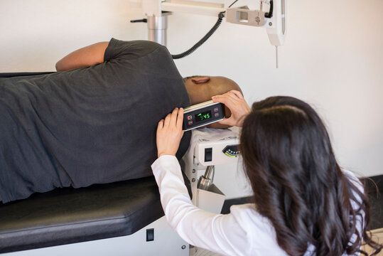 Doctor measuring patients neck atlas