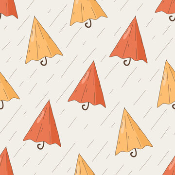 cute hand drawn red and yellow cartoon umbrella seamless vector pattern background illustration	