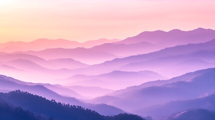 Obraz premium Misty Mountain Range with Fading Hills in the Soft Dawn Light