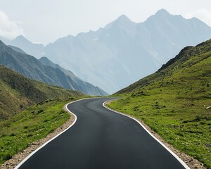 Obraz premium A highaltitude road winding through mountainous terrain, capturing a sense of adventure and travel