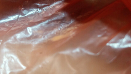 An abstract exploration of form and light, captured in the unique texture of plastic. This background offers a dynamic and intriguing visual for your designs.