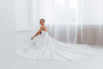 Fototapeta premium Photo from above of a girl in a dress with a long train