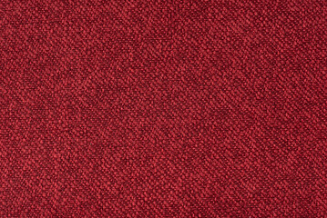 Texture of dense red fabric for tailoring. Canvas. Textile. Material