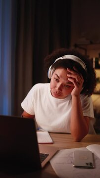 Boring tired young student or freelancer  falling asleep during study or work at home workplace at late night Stressed female exhausted from remote distance work or education and hard program indoors