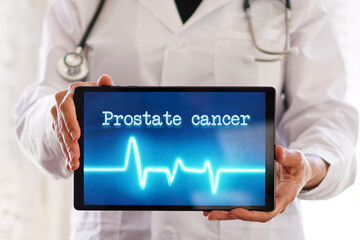 concept of prostate cancer. a doctor showing a tablet with a medical application.