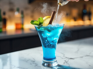 professional advertisement food photography: A blue cocktail being poured into a glass on a bar.