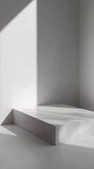 Minimalist light-colored podium with angular shadow