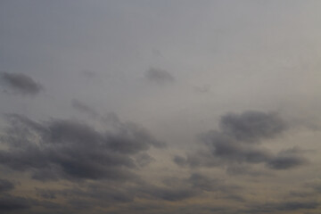 Gray sky with gray clouds, heavy gray clouds signaling a weather change, sky with gray clouds, clusters of gray clouds, bad weather.