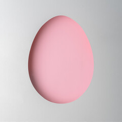Easter egg-shaped cutout with soft pink color on a light background. The minimalist design suits holiday themes, branding, and creative mockups