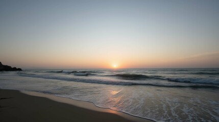 Obraz premium Tranquil Sunset Over Serene Beach With Gentle Ocean Waves