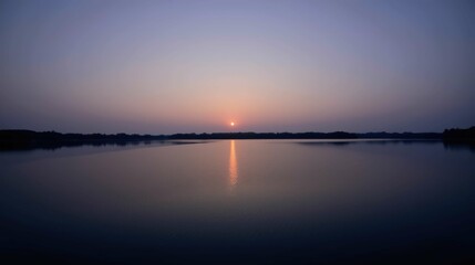 Obraz premium Serene Sunset Reflection Over Calm Water at Dusk Ensuring Tranquility