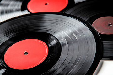 Red vinyl records close-up, white background, music