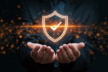 Concept of digital security represented by a glowing shield and a checkmark in someone's hands showcasing protection and trust