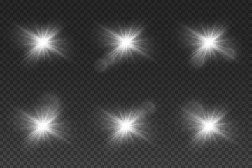 Set of lighting effects. A glare of a star, an explosion of light, light flashes. On a transparent background.