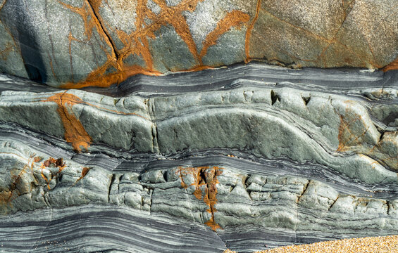 Textured Rock Formation with Coastal Layers