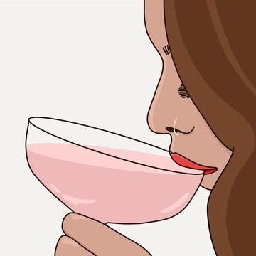Woman Drinking A Pink Cocktail