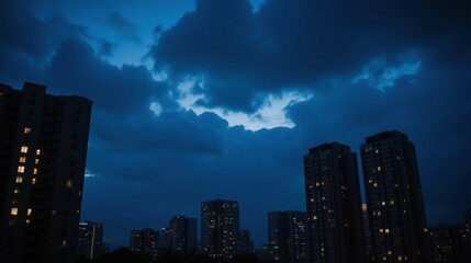 Fototapeta premium Urban Skyline at Dusk with Dramatic Clouds and City Lights