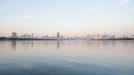 Fototapeta premium Serene City Skyline Reflection on Calm Water at Dusk