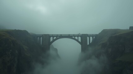 Misty Landscape with Arch Bridge and Fog Above the Canyon