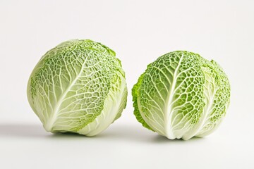 Fototapeta premium Two heads of cabbage on a clean white surface