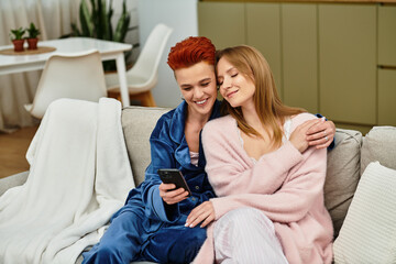 Fototapeta premium Joyful moments shared in a modern apartment between a young lesbian couple