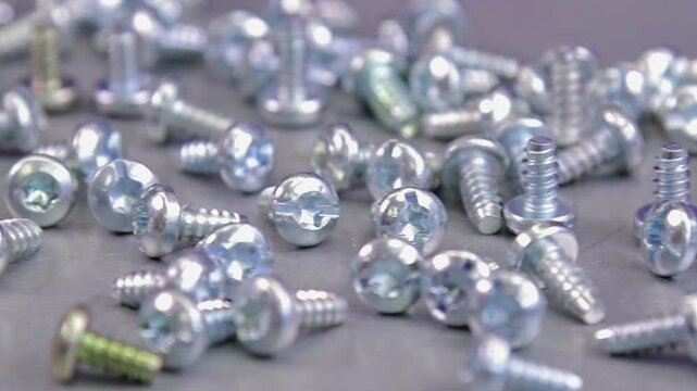 Metal screws for fastening equipment. Soft focus. Close-up. 