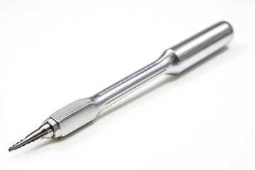 A single metal pen placed on a clean white surface, perfect for editorial or design use