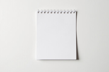 Spiral-bound notebook in minimalist style with copy space for text or notes against a clean background
