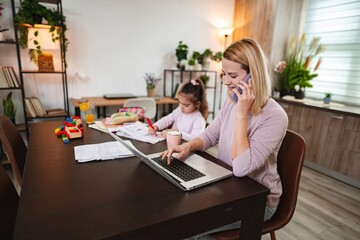 Busy mother balances work and parenting at home office space