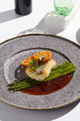 Modern Culinary Art Cod Fillet with Asparagus and Lotus